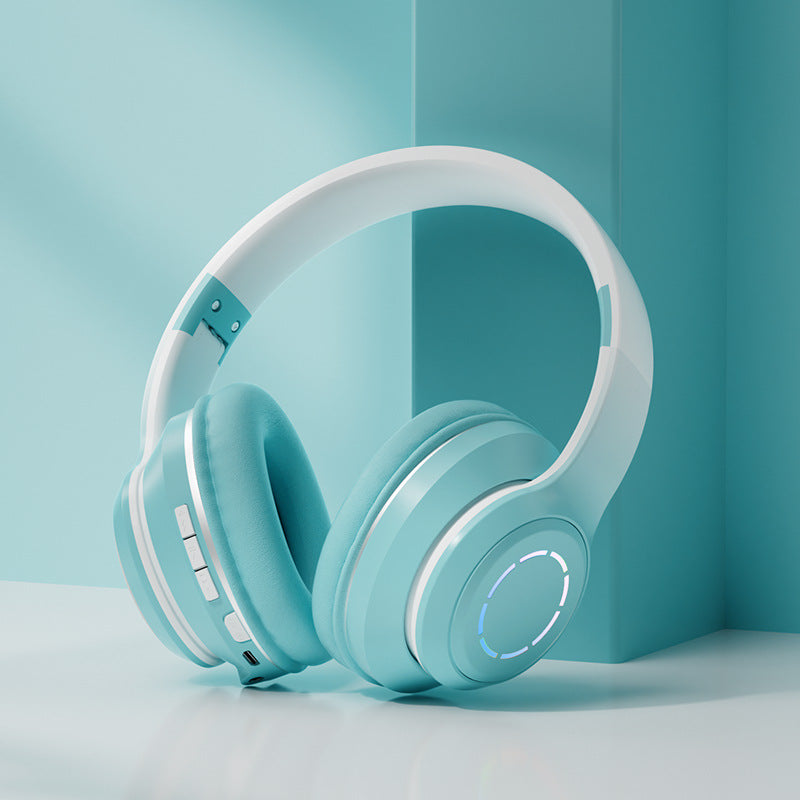 Auriculares Bluetooth plegables en color turquesa con controles para música y diseño ergonómico