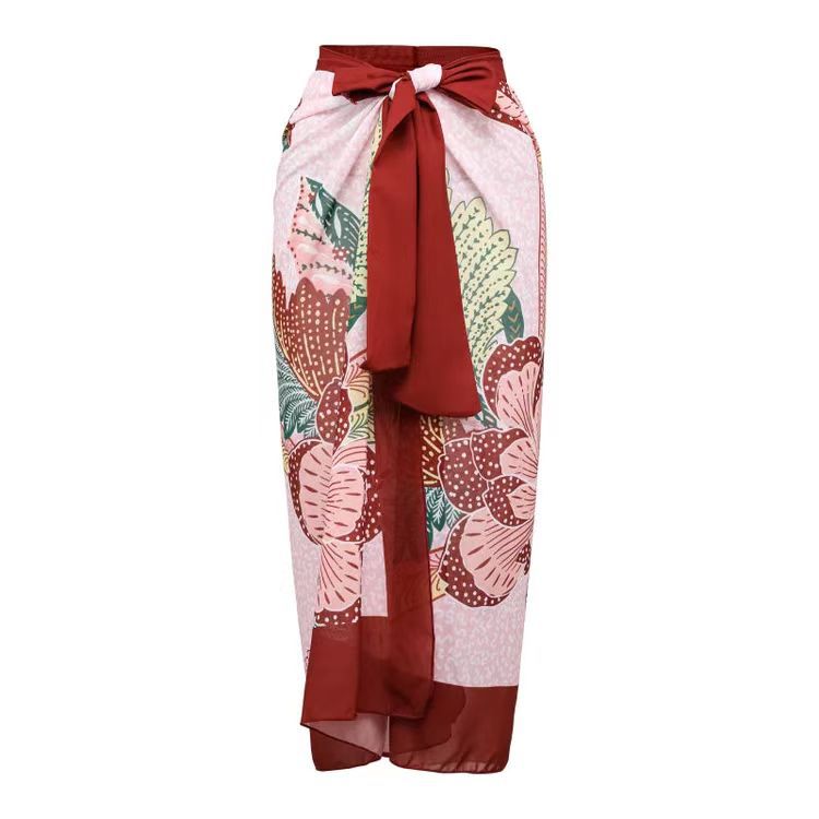 Falda larga con estampado floral en colores vivos, ideal para combinar con un bikini de vacaciones elegantes