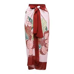 Falda larga con estampado floral en colores vivos, ideal para combinar con un bikini de vacaciones elegantes