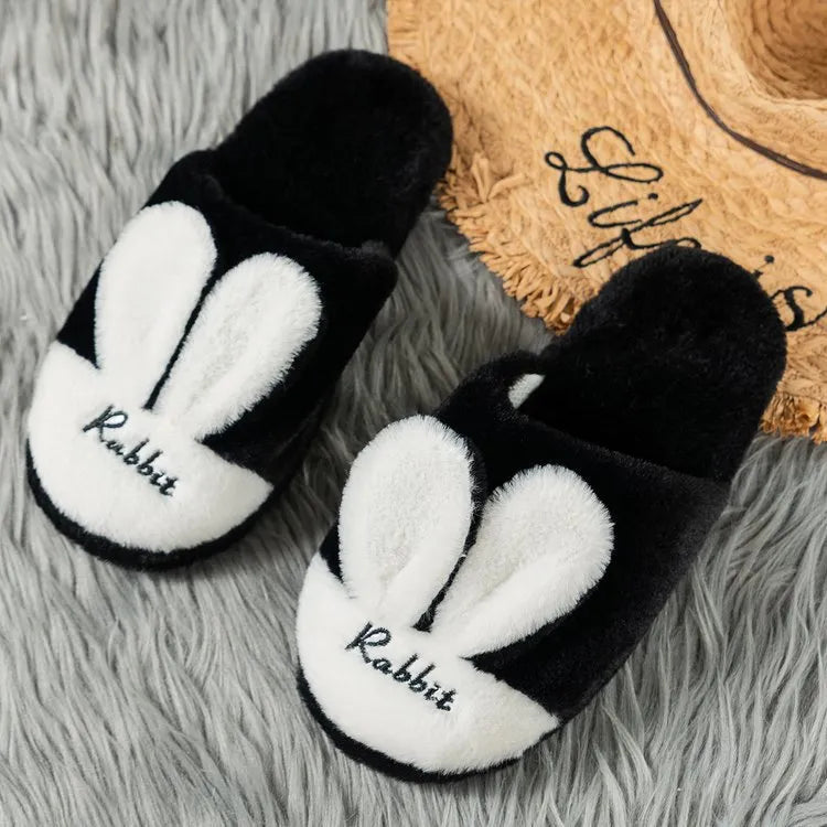 Pantuflas orejas de conejo en negro y blanco, suaves y cómodas para uso en casa