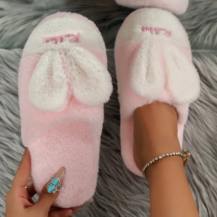 Pantuflas orejas de conejo en color rosa suave con detalles de lazo y textura suave y cómoda